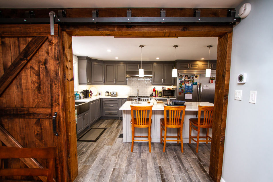 View of a kitchen through a sliding barn door